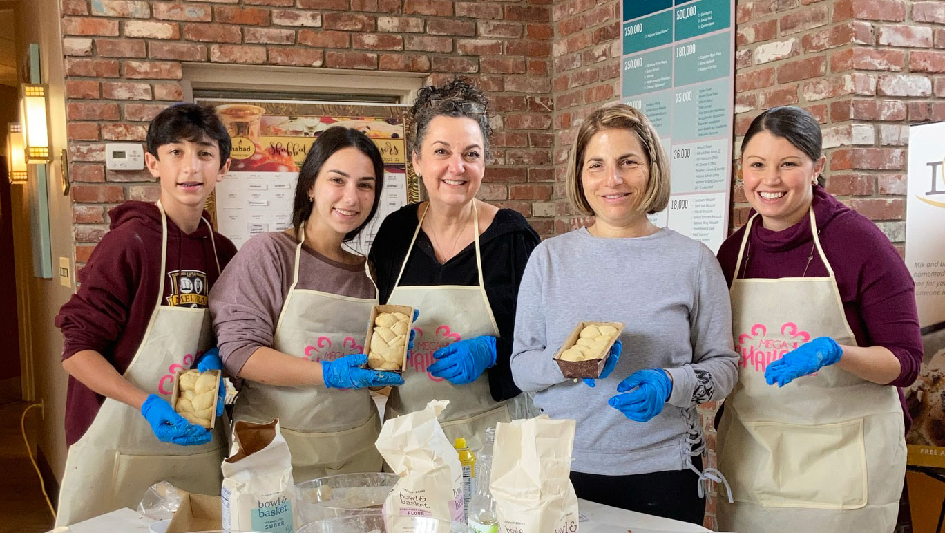Kitchen of Kindness volunteers preparing meals